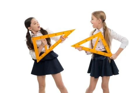 A lesson for the future. Small children with measuring instruments at school Stock Photos