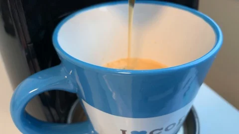 Let coffee out of a coffee machine Stock Footage 108487236
