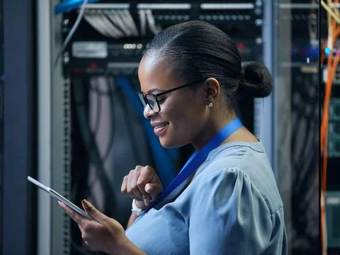Let her rewire your network. Cropped shot of an attractive female programmer  写真素材