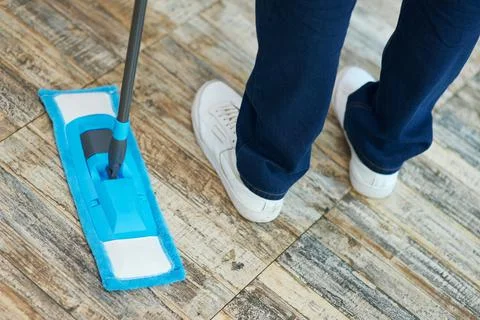 Let it be clean. Close up shot of a man, professional male cleaner using mop Stock Photos