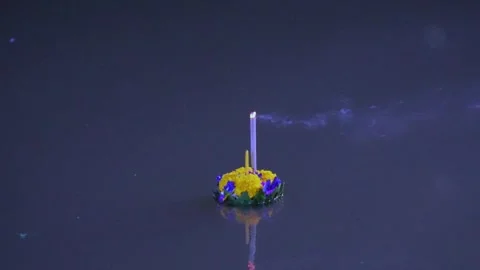 Let the Krathongs float downstream at night. Stock Footage 257054419