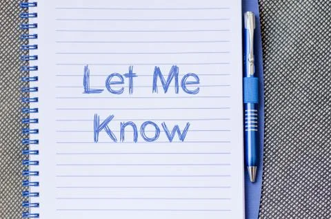 Let me know write on notebook Stock Photos