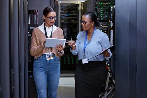 Lets check the connectivity. two attractive young female computer programmers Stock Photos