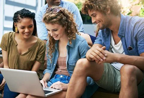 Lets get this assignment done so we can have some fun. Shot of a group of Stock Photos