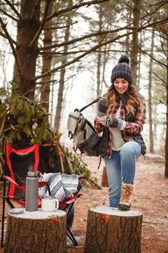Lets get going again - adventure awaits. a young woman camping in the wilderness Stock Photos