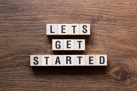 Lets get started - word concept on building blocks, text Fotos de archivo