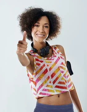 Lets get this workout started. Portrait of a young woman showing thumbs up. Stock Photos