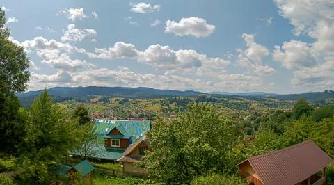 Let's go up the mountain. Landscape with clouds, pine trees and green grass.. Фото