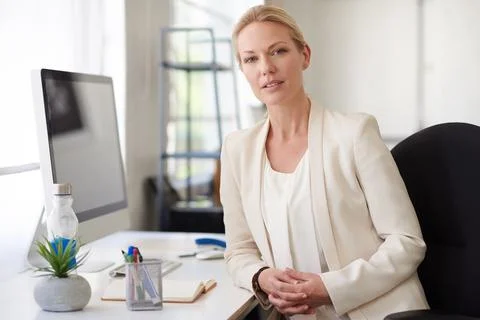 Lets look at the future together. Serious creative professional woman looking Stock Photos