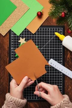 Let's make a simple paper craft. A bookmark in the shape of a Christmas tre.. Stock Photos