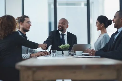 Lets seal it with a handshake. two businesspeople shaking hands in a staff Stock Photos