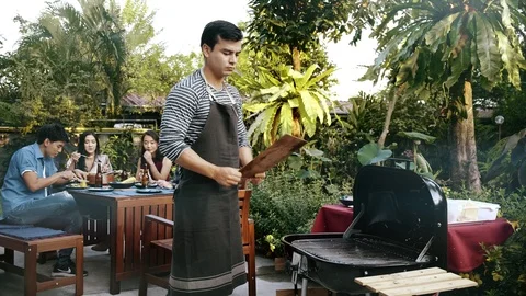 Let's start a bbq grill. Stock Footage 99017480