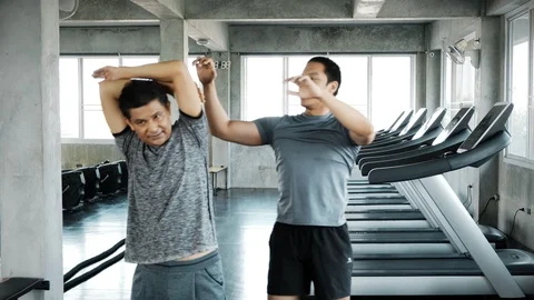 Lets stretch your body, old man. Stock Footage 103437581