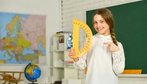 Lets study together. Learning to use protractor. back to school. High school 库存照片