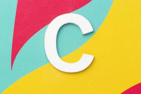 Letter C of the alphabet on colored background, top view Stock Illustration