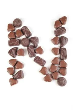 Letter from chocolates Stock Photos