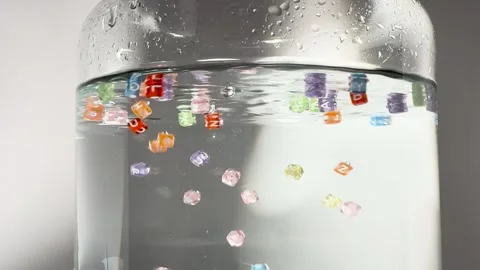 The letter cubes fall into the water Stock Footage 257478287