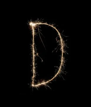 Letter D drew with spakrs on a black background. Stock Photos
