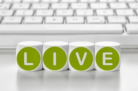 Letter dice in front of a keyboard - Live Letter dice in front of a keyboa... Stock-Fotos