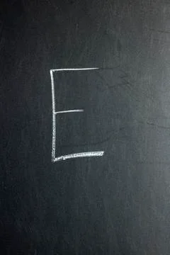 Letter E on a chalk board. School concept. Stock Photos