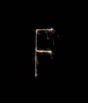 Letter F drew with spakrs on a black background. Stock Photos