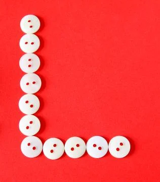 Letter "l" from buttons on a red background Stock Illustration