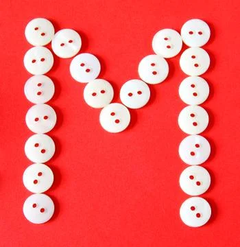 Letter "m" from buttons on a red background Stock Illustration