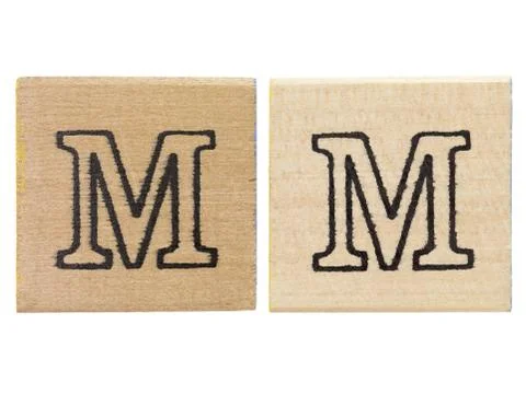 Letter m written on brown frames Stock Photos