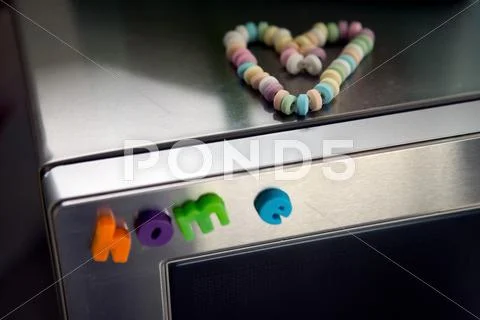 Letter Magnets On Microwave Oven