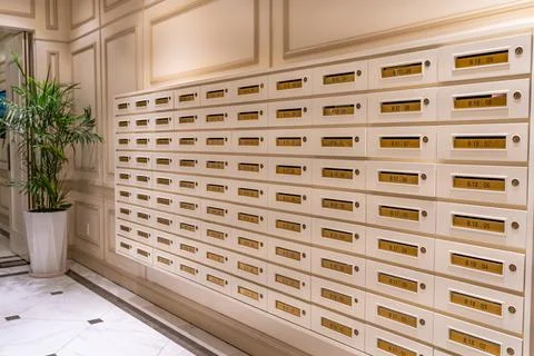 Letter mailbox array at elegant condominium entrance hall 스톡 사진