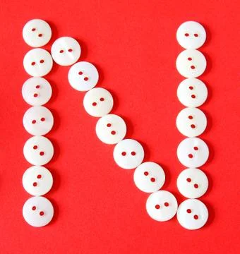Letter "n" from buttons on a red background Stock Illustration