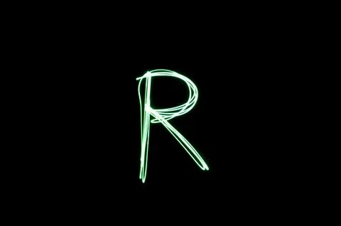Letter R written with light paint photography technique on black background.  Stock Illustration