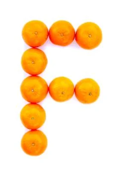 Letter solved with tangerines Stock Photos