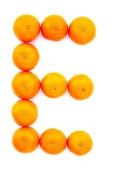 Letter solved with tangerines Stock Photos