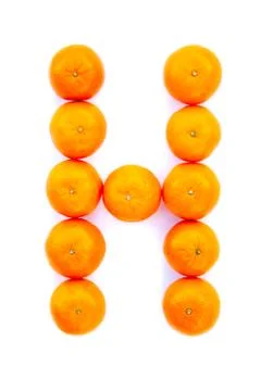Letter solved with tangerines Stock Photos