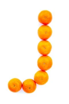 Letter solved with tangerines Stock Photos