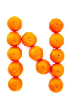 Letter solved with tangerines Stock Photos
