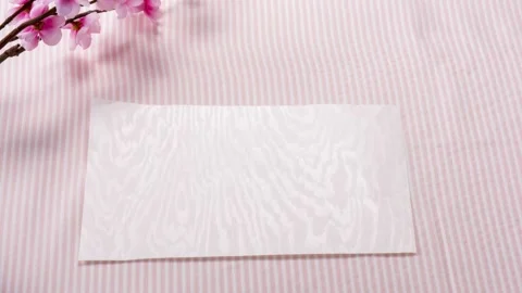 Letter With Spring Blossoms on Pink Striped Background Stock Footage 339596395