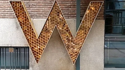 Letter W shape sign with lighting up in slow motion Stock Footage 114886297