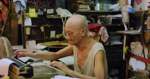 A letter writer artisan working, a master in producing tax forms, accounting, le Stock Footage 201094903