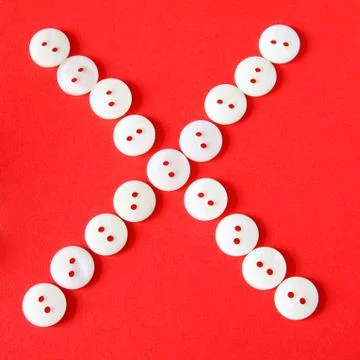 Letter "x" from buttons on a red background Stock Illustration