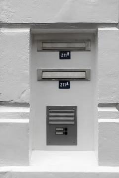 Letterboxes and intercom in white plastered wall, Utrecht, the Netherlands Stock Photos