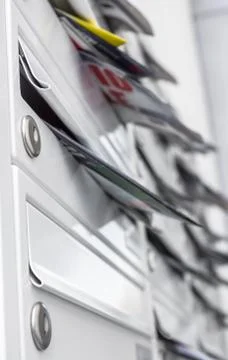 Letterboxes filled Stock Photos