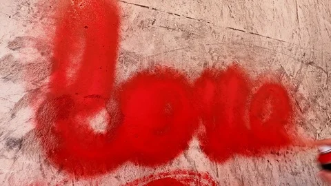 Lettering on the wall in red spray paint Stock Footage 126053503
