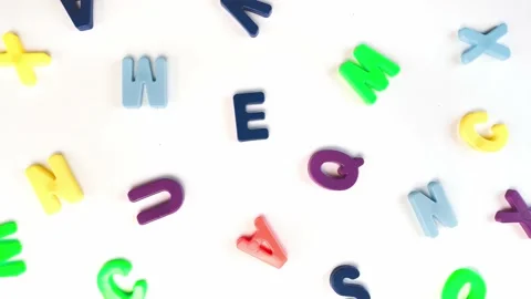 Lettermulticolored letters rotating on white background. 動画素材 194081936