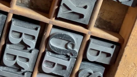 Letterpress printer typecase with metal type Stock Footage 220436374