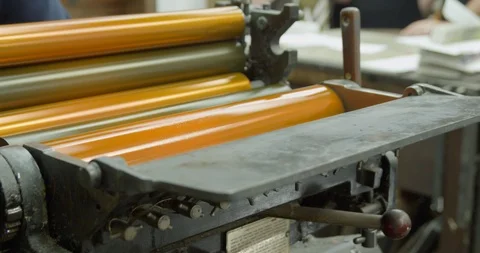 Letterpress printing machine inking rollers with yellow ink. Heidelberg Stock Footage 102192731