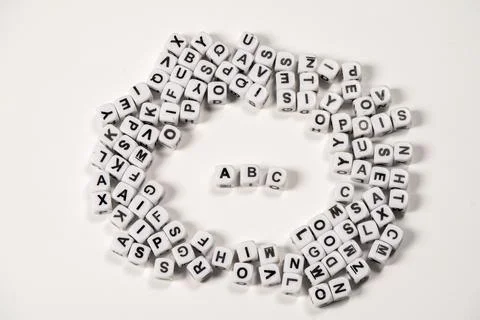 Letters arranged in a circle with a focus on the ABC letters Stock Photos