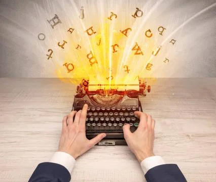 Letters exploding from a vintage typewriter Stock Photos