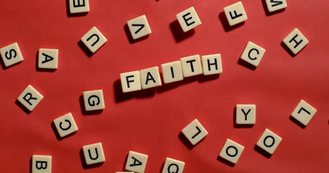 Letters fly up and fall to spell faith Stock-Footage 254037741